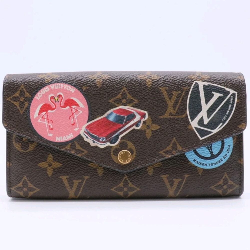 LOUIS VUITTON LIMITED EDITION WORLD TOUR SARAH WALLET NM MONOGRAM CANVAS
